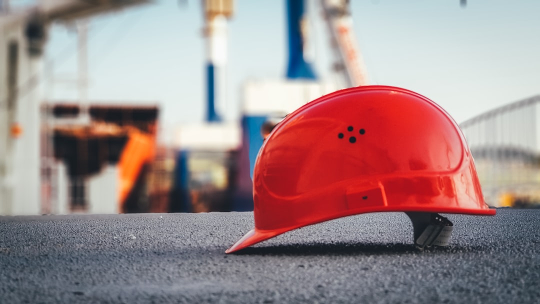 Worker wearing a safety hard hat on a job site